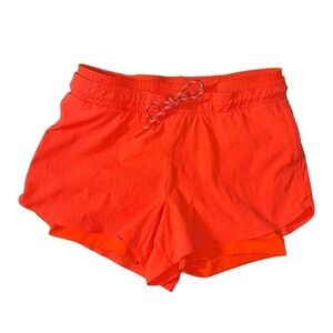 Athleta Trekkie Crest 2 in 1 Shortie in Racing Red Athletic Ripstop Neon Shorts